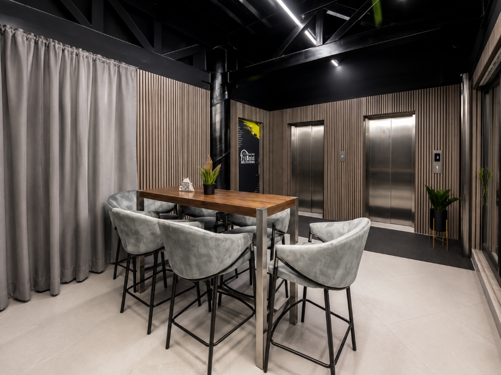 Zona de ascensores y mesa ejecutiva
